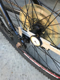 Clamp to spokes Chain sprocket alignment disc.